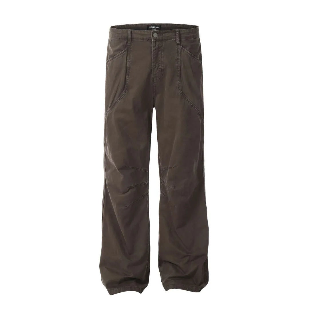 Man wearing brown loose fit high-waist straight leg cotton jeans trousers