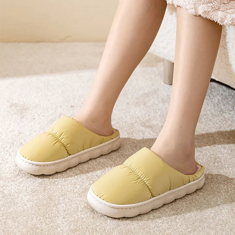 Down cotton winter slippers with artificial leather upper, thick rubber sole, and plush lining in blue colour