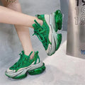 Women's green leather casual sports shoes with jelly detailing and white cross-tie lacing