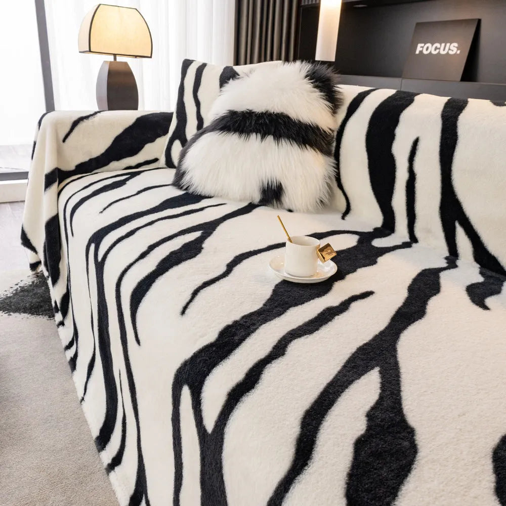 Zebra pattern flannel sofa slipcover in caramel colour showing non-slip underside and matching pillowcase