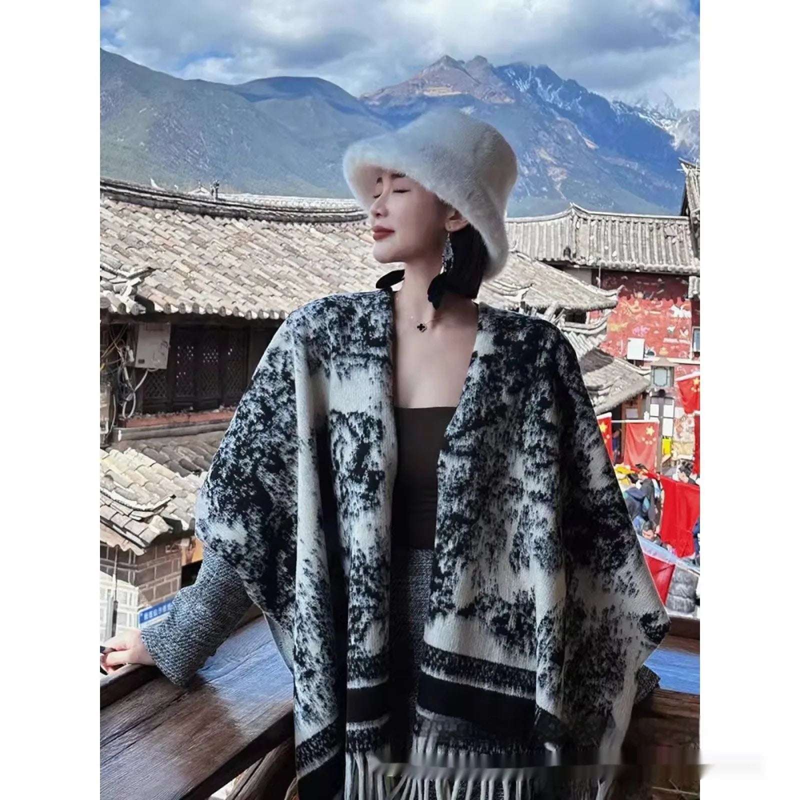Women's casual polyester scarf cape with tassels worn as a shawl.
