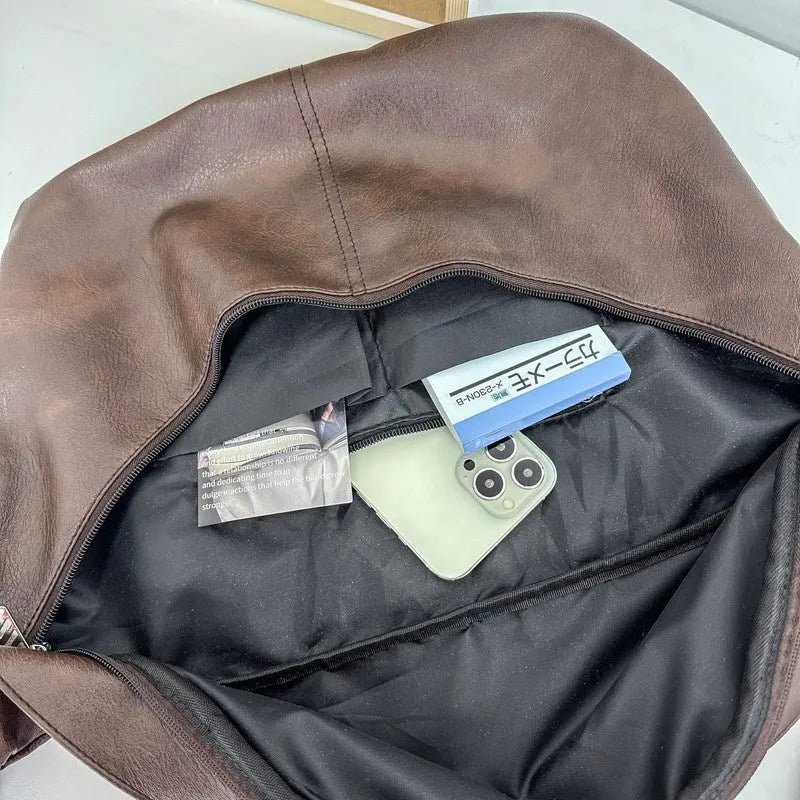 Retro large capacity men's crossbody bag in brown PU leather with zipper closure on white background.
