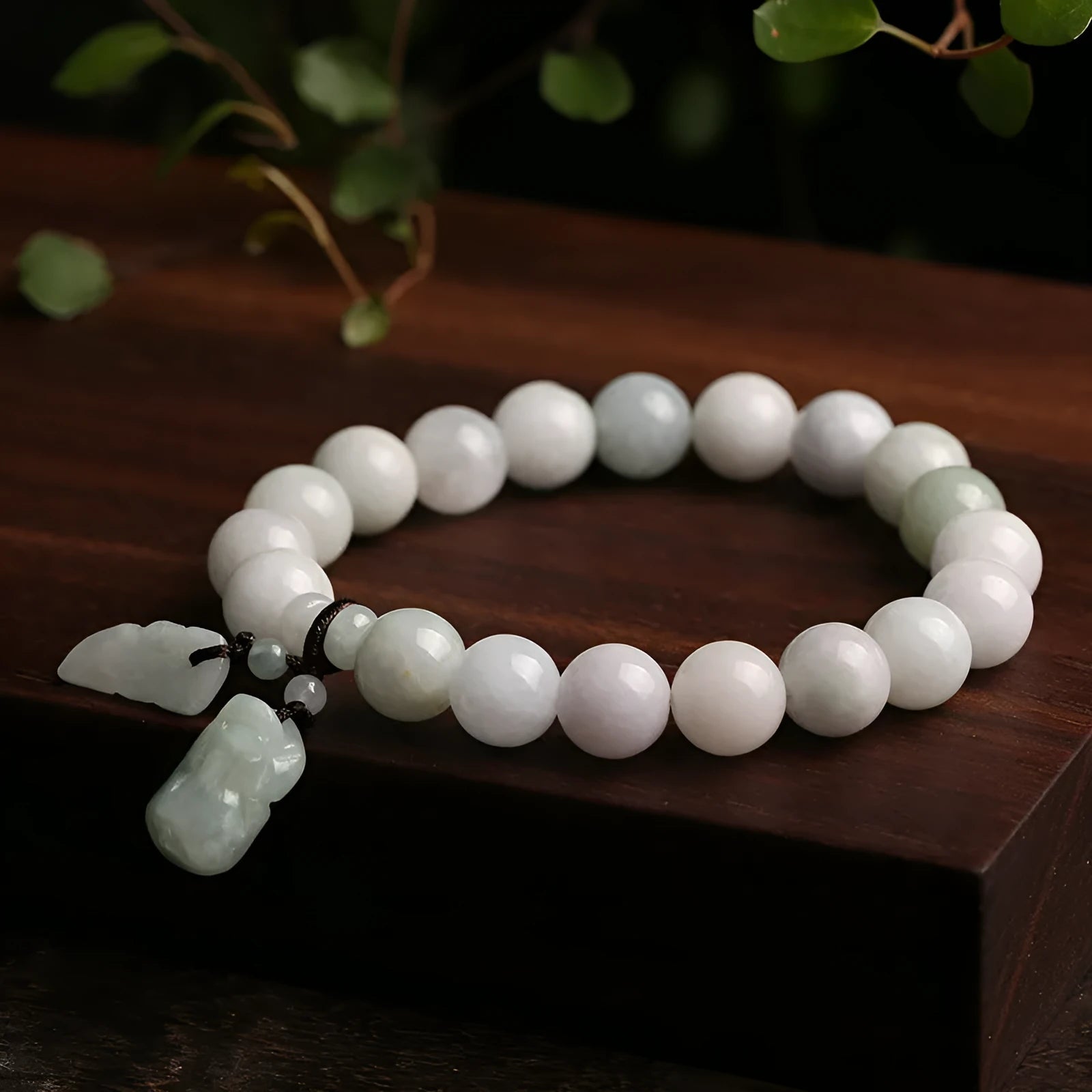 Green jade bracelet with geometric hanging beads and Maitreya Buddha charm