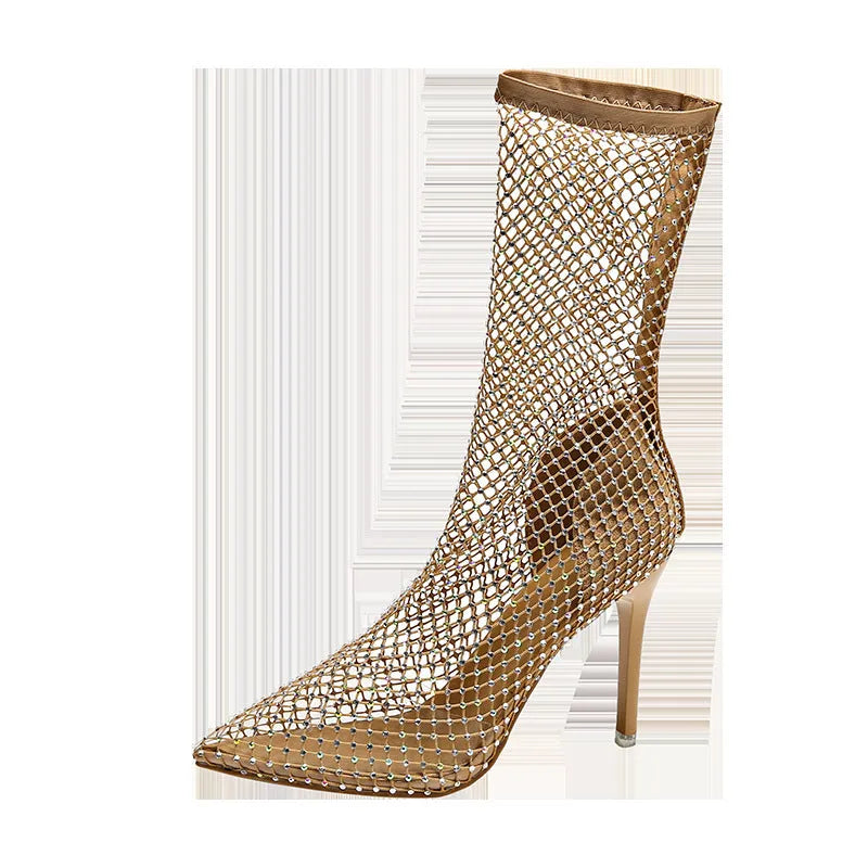 Gold women's stiletto sandals with mesh upper and pointed toe on a rubber sole.