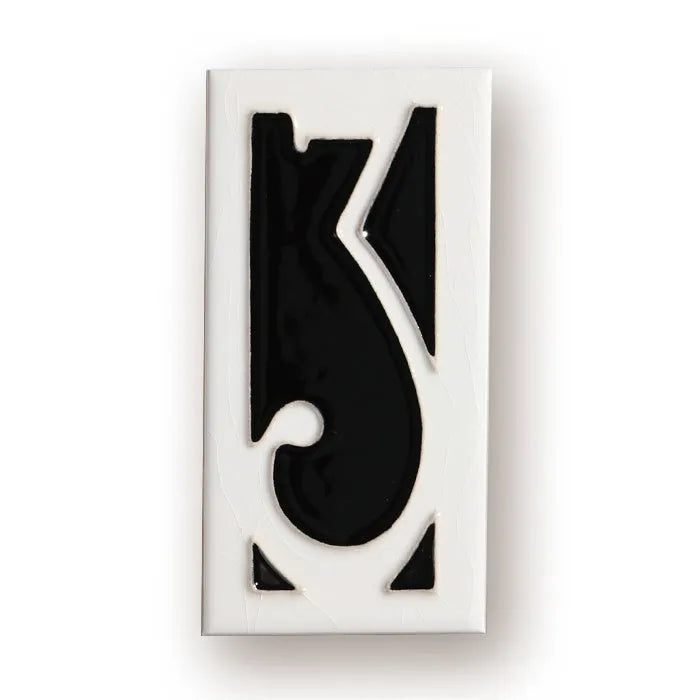 Handmade retro enamel ceramic doorplate showing a number on a glossy surface