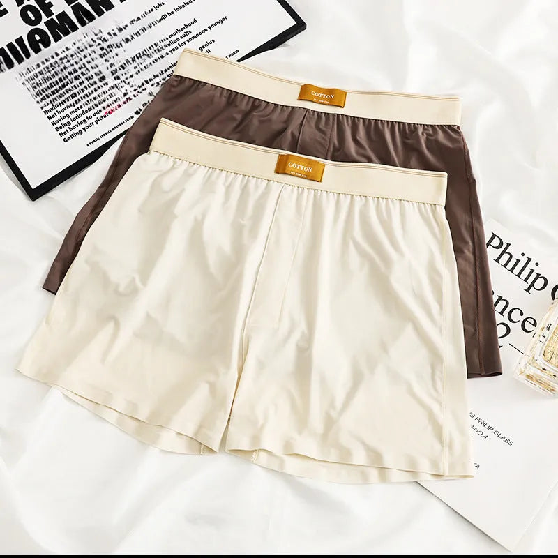 Men's solid colour loose Ice Silk underwear briefs on a neutral background