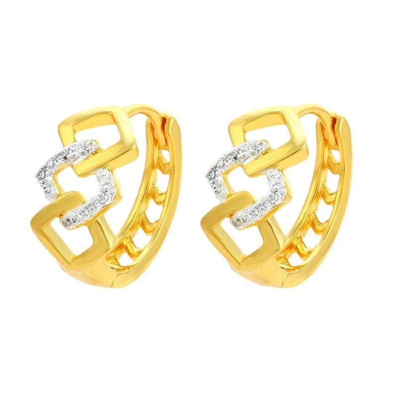 A pair of gold geometric earrings with a hollow out design and clip-on fastening.