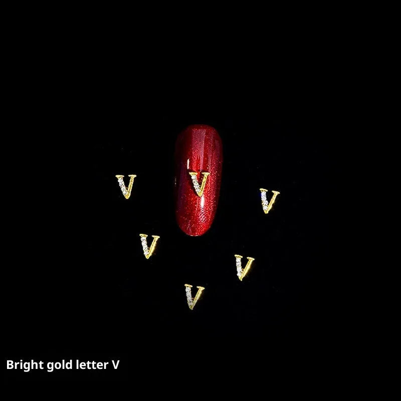 Gold alloy letter A nail ornament charm with crystal detail on a square chain base