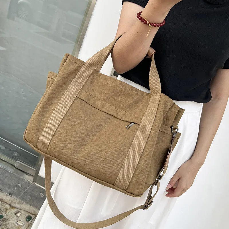 Large capacity canvas tote bag with internal organisers and side zippers in Army Green colour