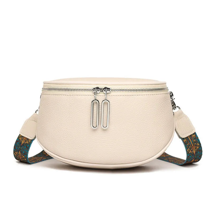 Women's soft PU messenger bag in saddle shape with single shoulder strap and internal organisation