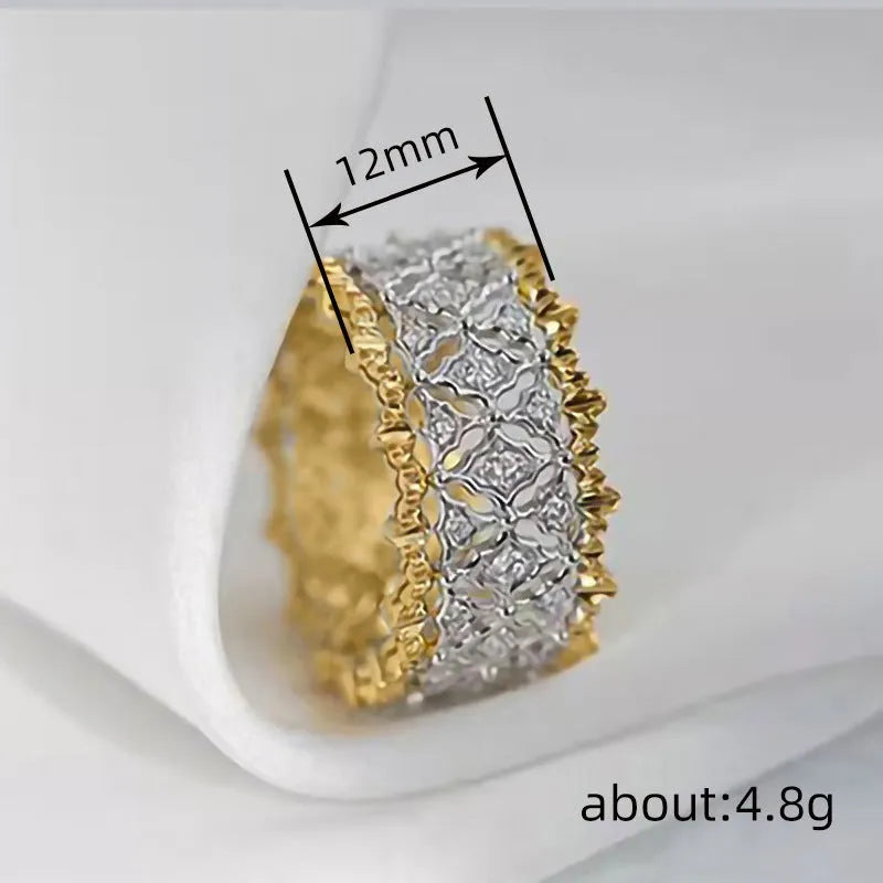 A geometric two-tone zircon ring with a gold-colour electroplated copper finish and round details.