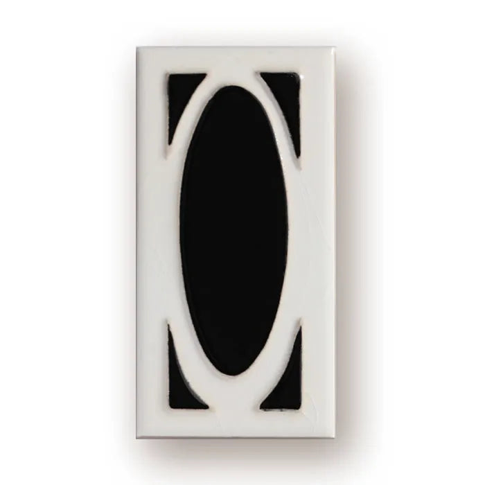 Handmade retro enamel ceramic doorplate showing a number on a glossy surface