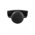 Black silicone steering wheel assist ball with metal bearing mounted on car steering wheel