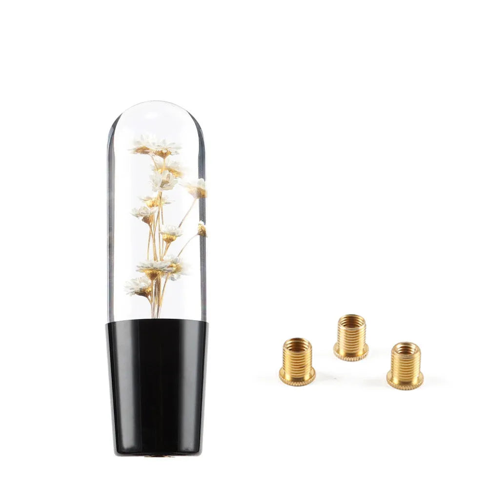 Transparent crystal car gear shift knob in assorted colours with three metal adapters.