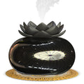 Pure black round lotus aromatherapy humidifier with USB cable and ceramic stone.
