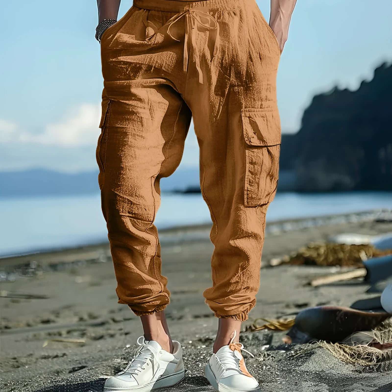 Man wearing khaki linen casual trousers with ankle-tied legs and multiple pockets.