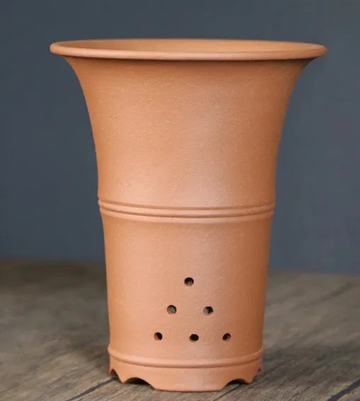 Large-diameter purple clay orchid pot in S1787 colour, placed on a tabletop, suitable for clivia and succulents