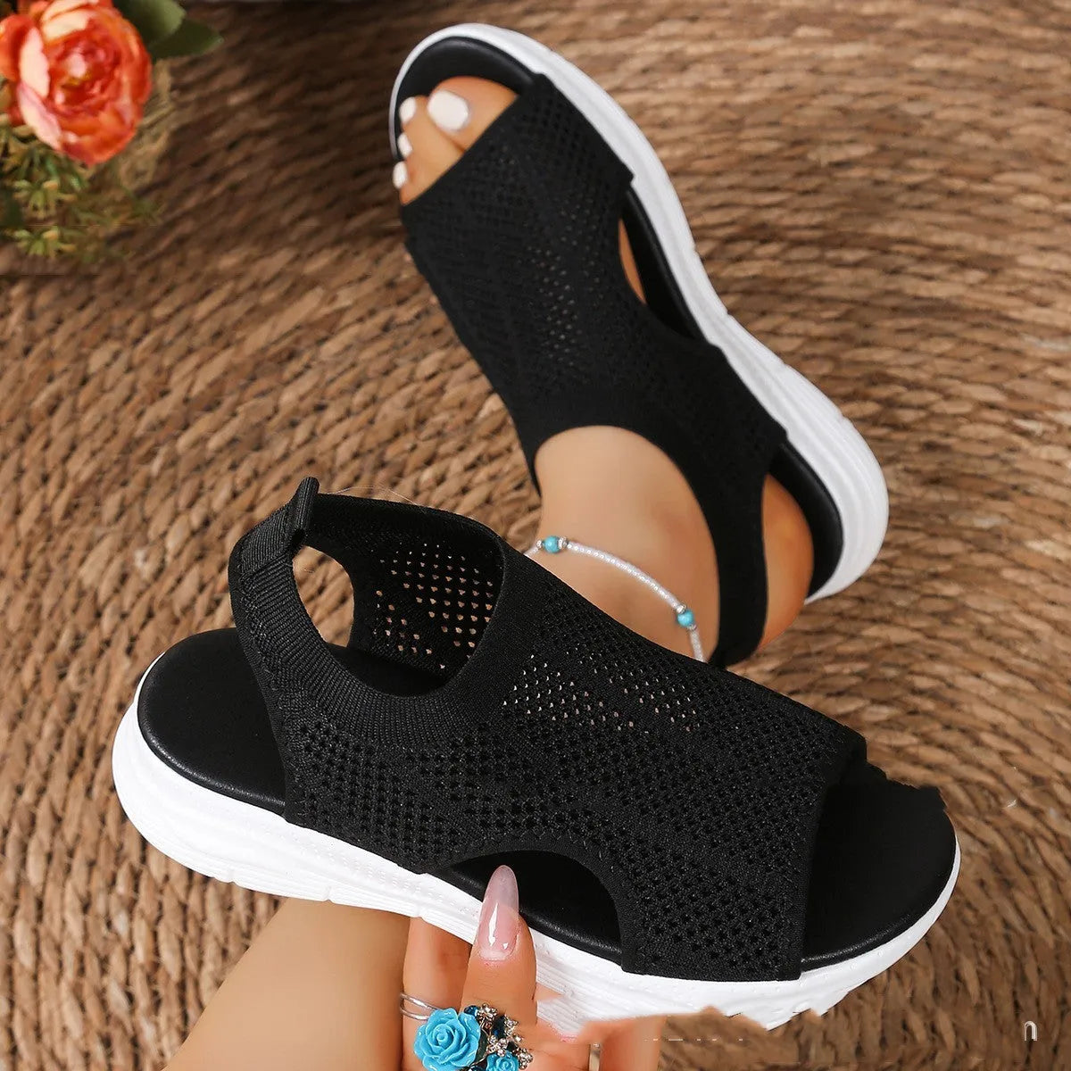 Women's black platform sports sandals with mesh lining and a flat toe bracket on a rubber sole.