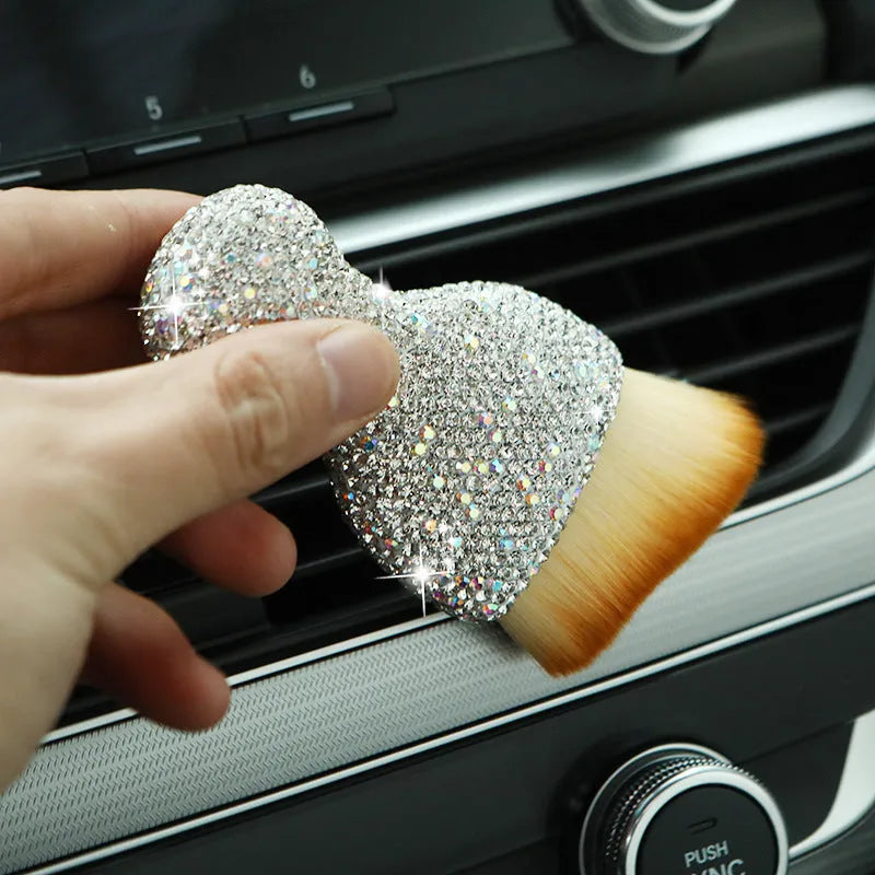 Car interior cleaning brush with soft PVC bristles, shown in white, pink, and black colour options