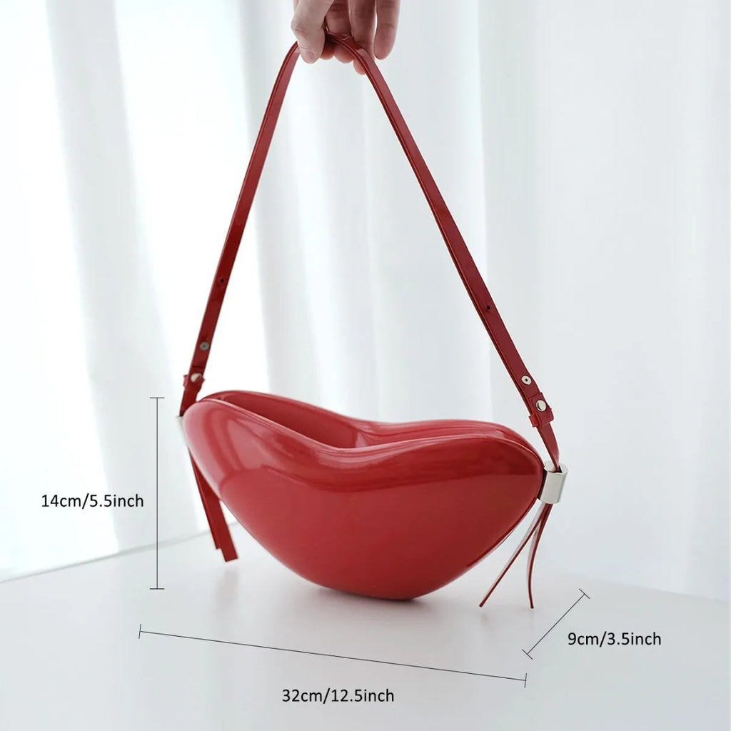 Red heart-shaped crossbody bag in PU material with single shoulder strap and exterior pocket