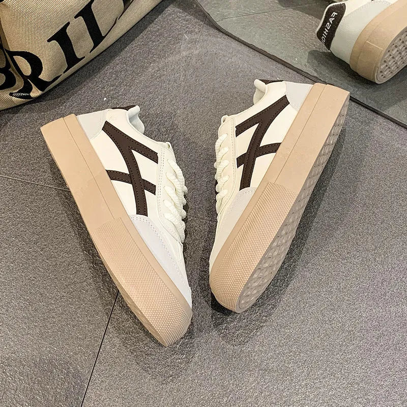 Casual board shoes in brown with low-top design, round toe, and flat rubber sole