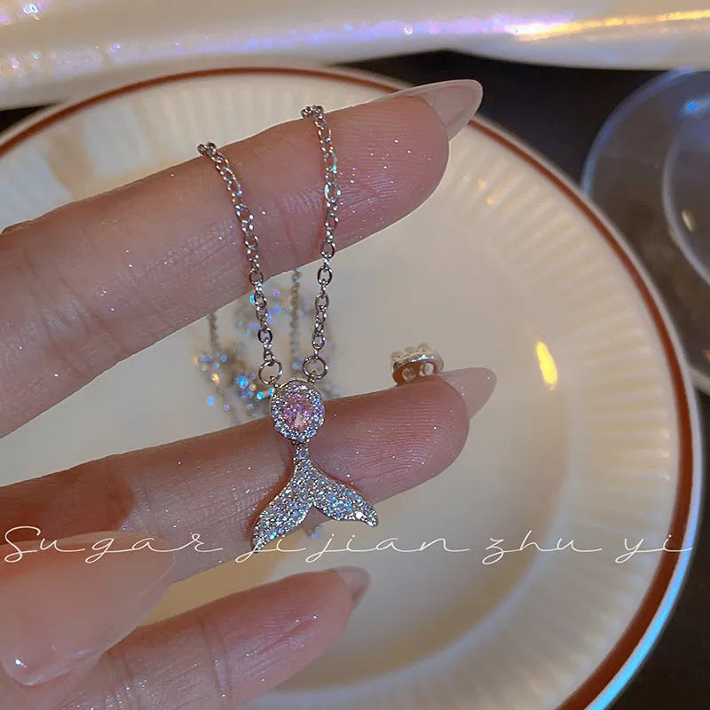 Women's sterling silver necklace with a choice of fishtail or angel wing pendant on an O-ring chain.