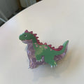 Dinosaur-themed acrylic jaw hair clip showing grip design with miniature dinosaur decoration