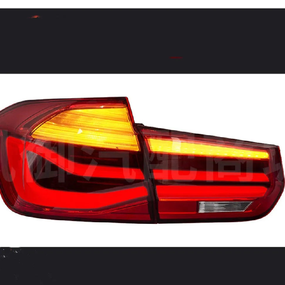 BMW 3 Series modified LED tail light assembly in smoked black finish, showing streamer light pattern.