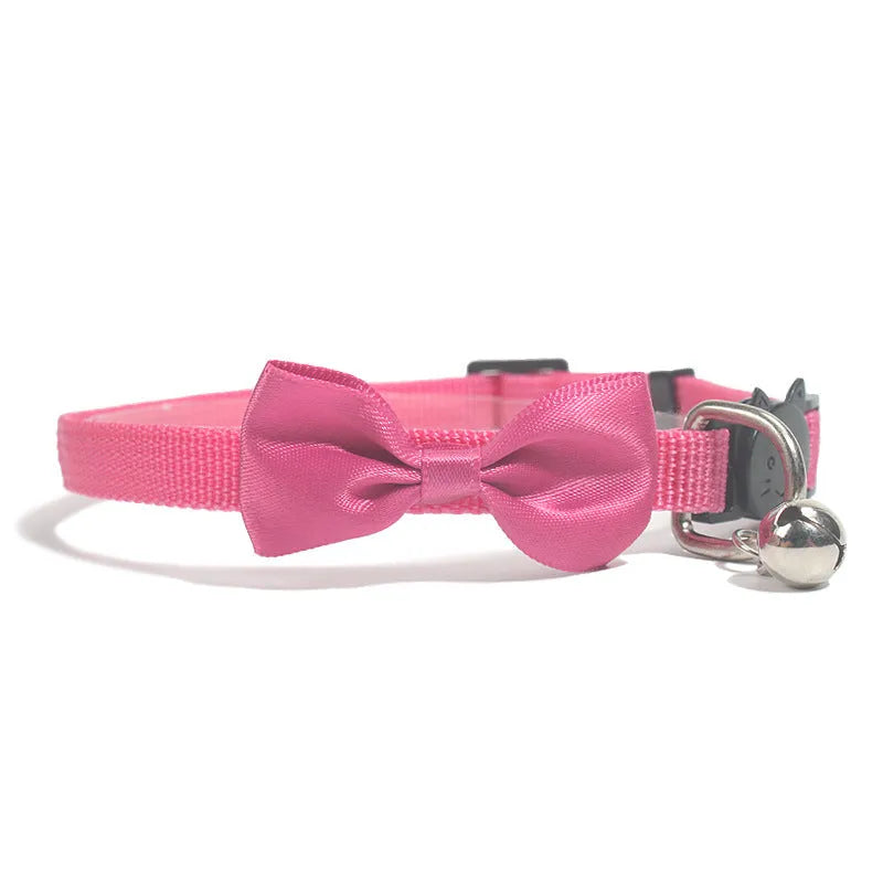 Adjustable striped nylon cat collar with a small bell, shown in multiple colour options on a white background.