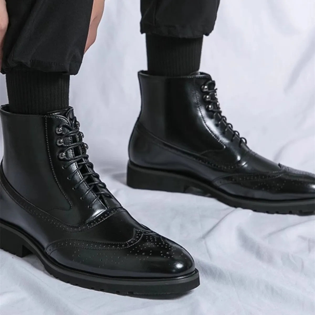 Men's mid top leather work shoes in black with thick sole and sturdy stitching