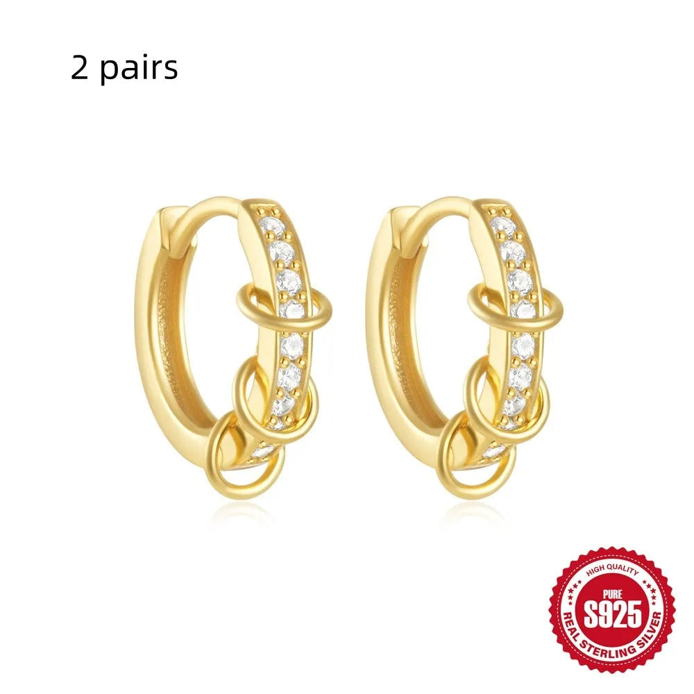 Small round geometric sterling silver stud earrings in gold and silver electroplated finishes.