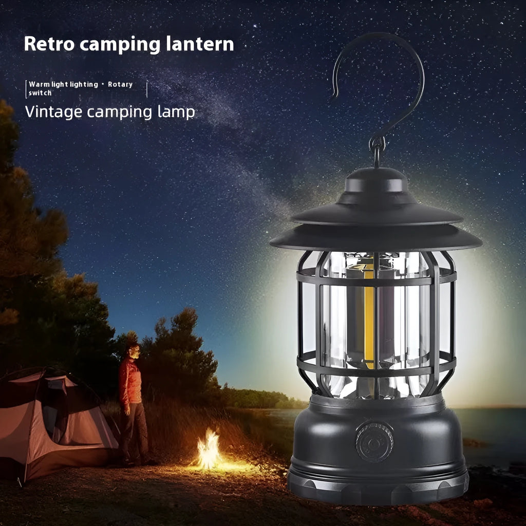 Dark green portable LED camping lantern and head lamp showing compact design and head strap.