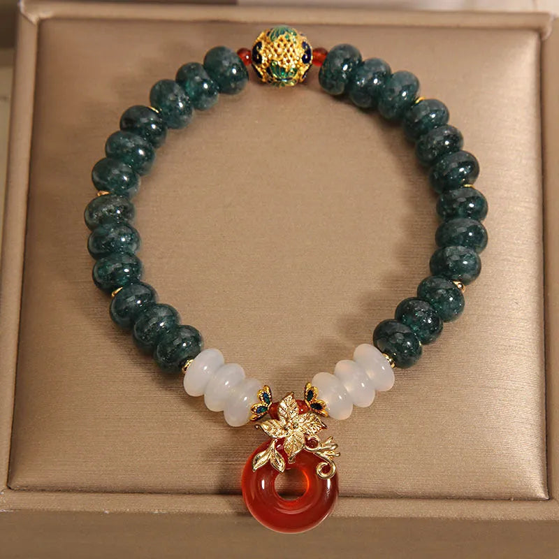 Blue water jade abacus bead crystal bracelet with red agate peace buckle and rhinestone details