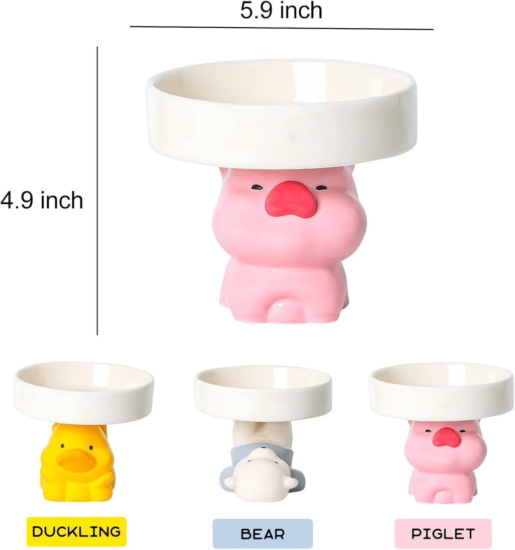 Raised ceramic cat bowl in animal design, showing elevated feeder stand and wide food bowl opening.