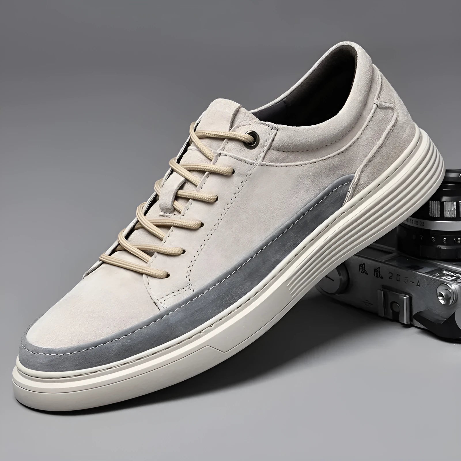 Men's grey casual leather skate shoes with round toe, low top design and rubber soles