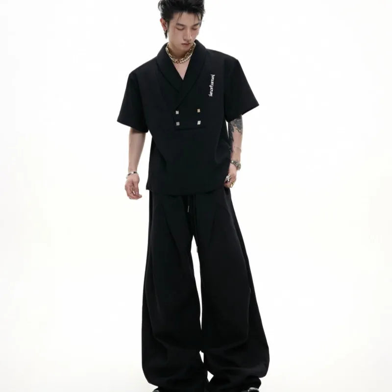 Men's dark grey cotton sports suit with metal embellishments, V-neck design, and padded shoulders