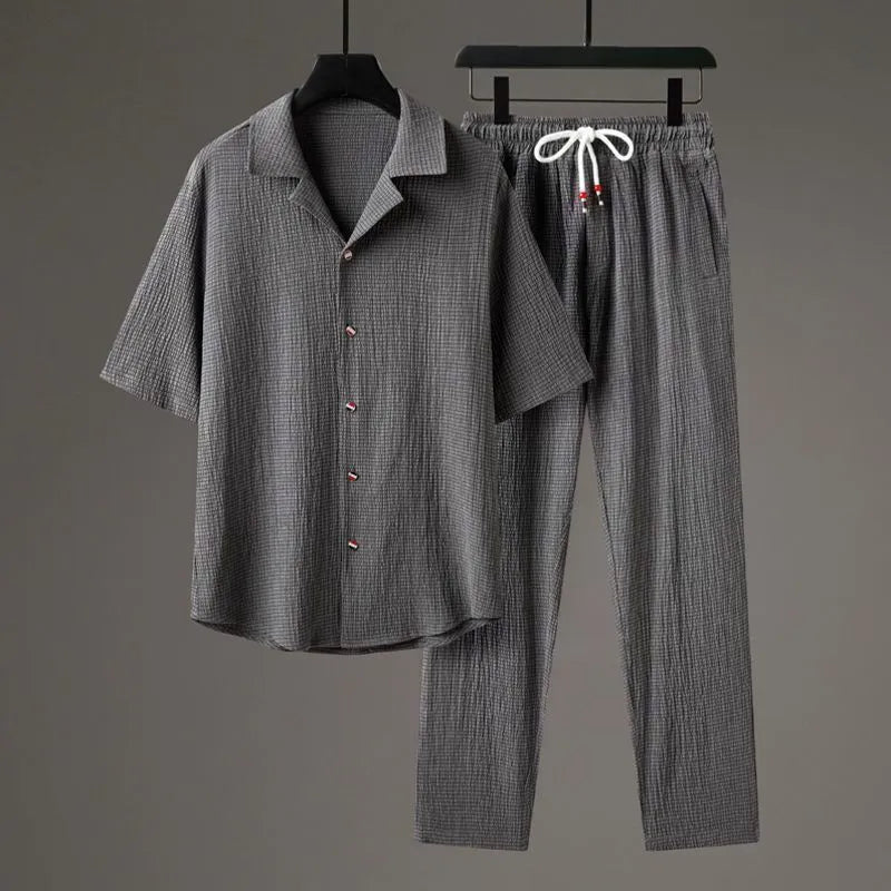 Men's national style two-piece sportswear set showing knitted half-sleeve top and full-length trousers