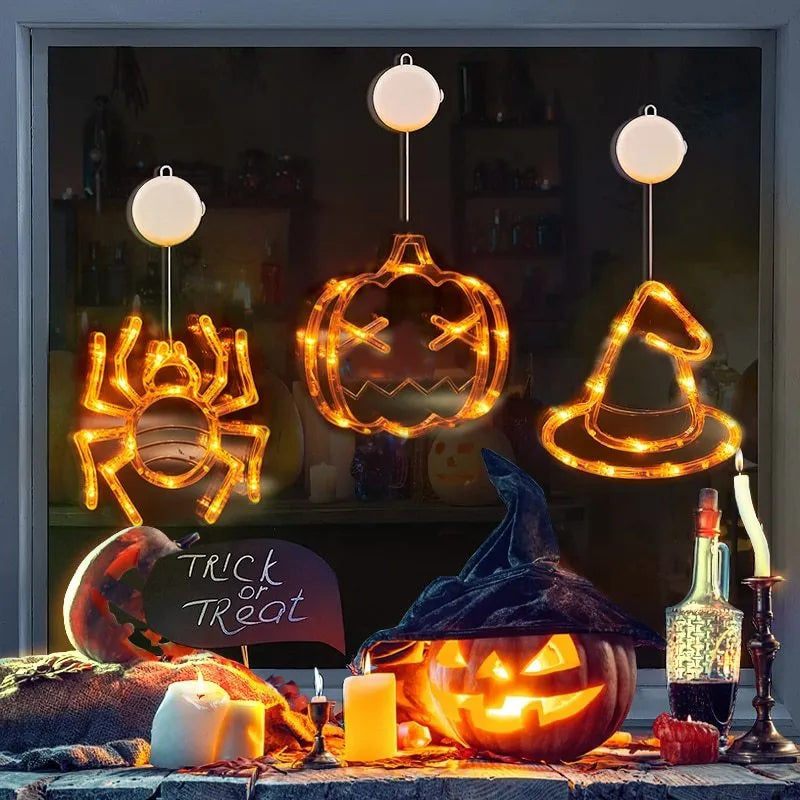 Seven Halloween LED window lights with spider, pumpkin and ghost designs on suction cups