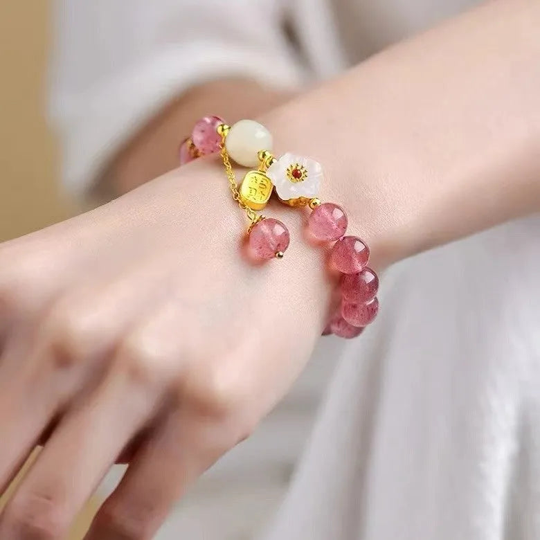 Handcrafted strawberry quartz crystal bracelet with Hetian jade peach blossom charms for women