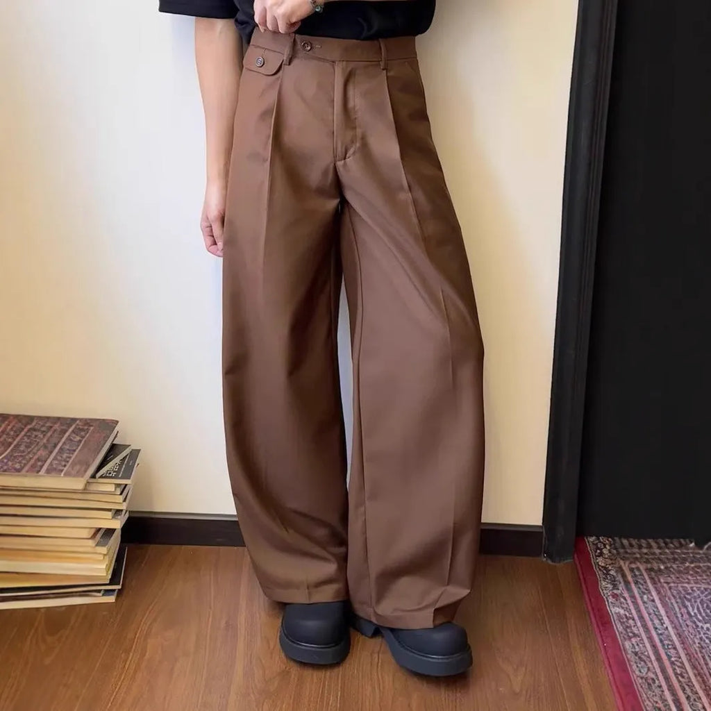 Men's straight-leg casual trousers in black with wide-leg draping silhouette on hanger