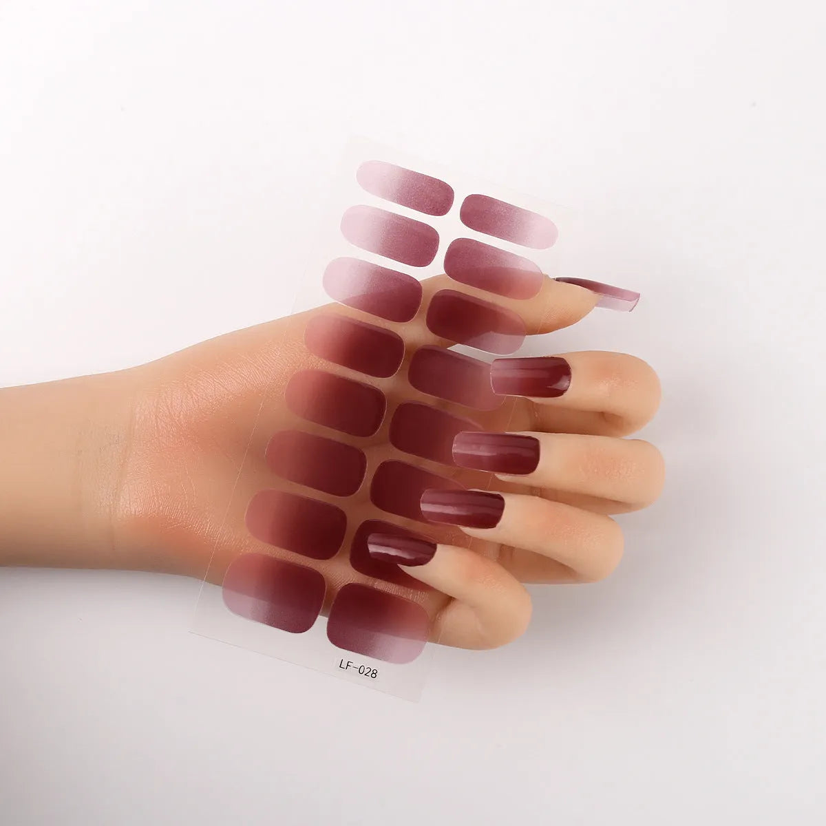 Set of 16 solid colour full nail art stickers showing patterns like cross, rose, tulip, and cartoon designs.