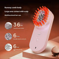 Pink and black smart massage comb for scalp care with red light therapy, shown next to its box.