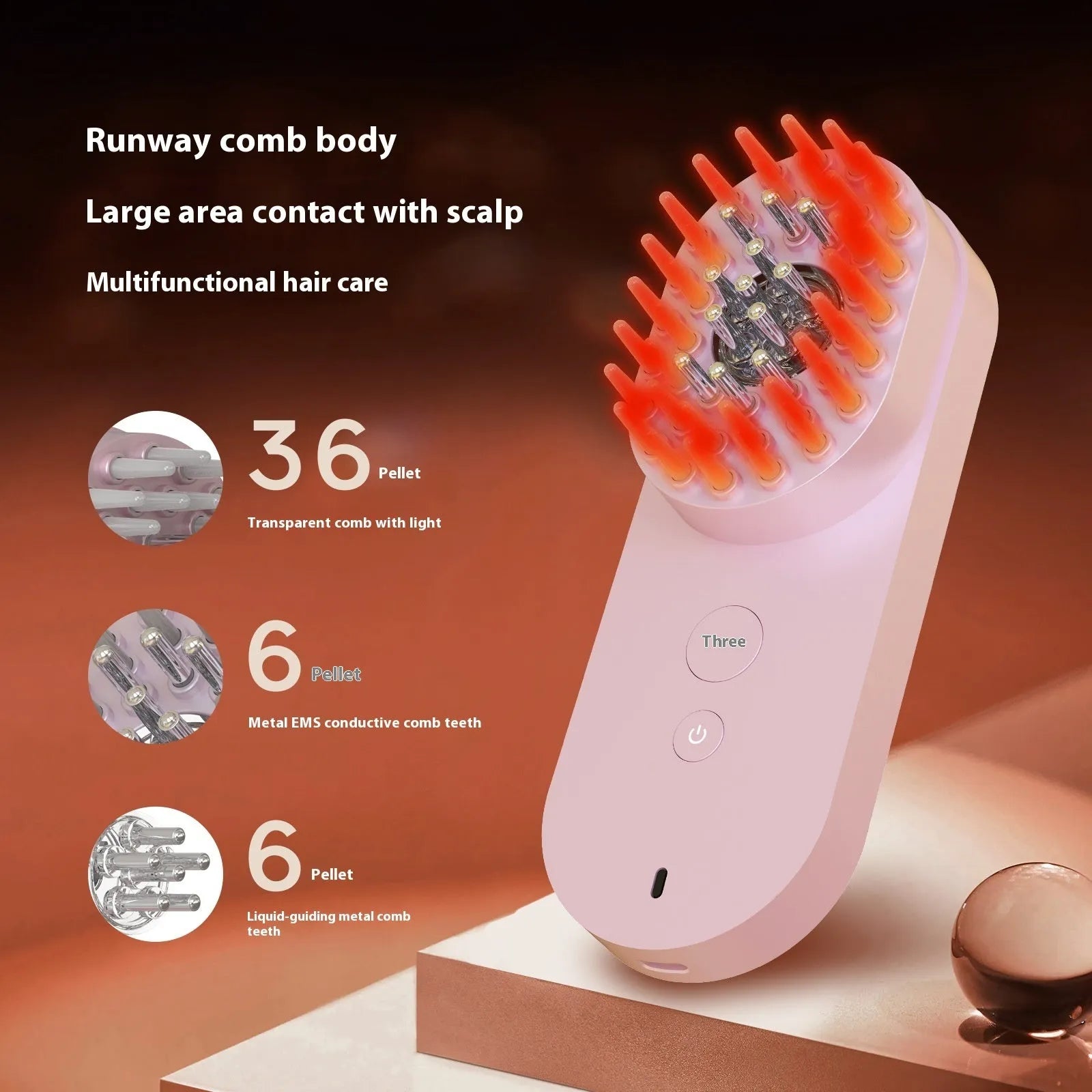 Pink and black smart massage comb for scalp care with red light therapy, shown next to its box.