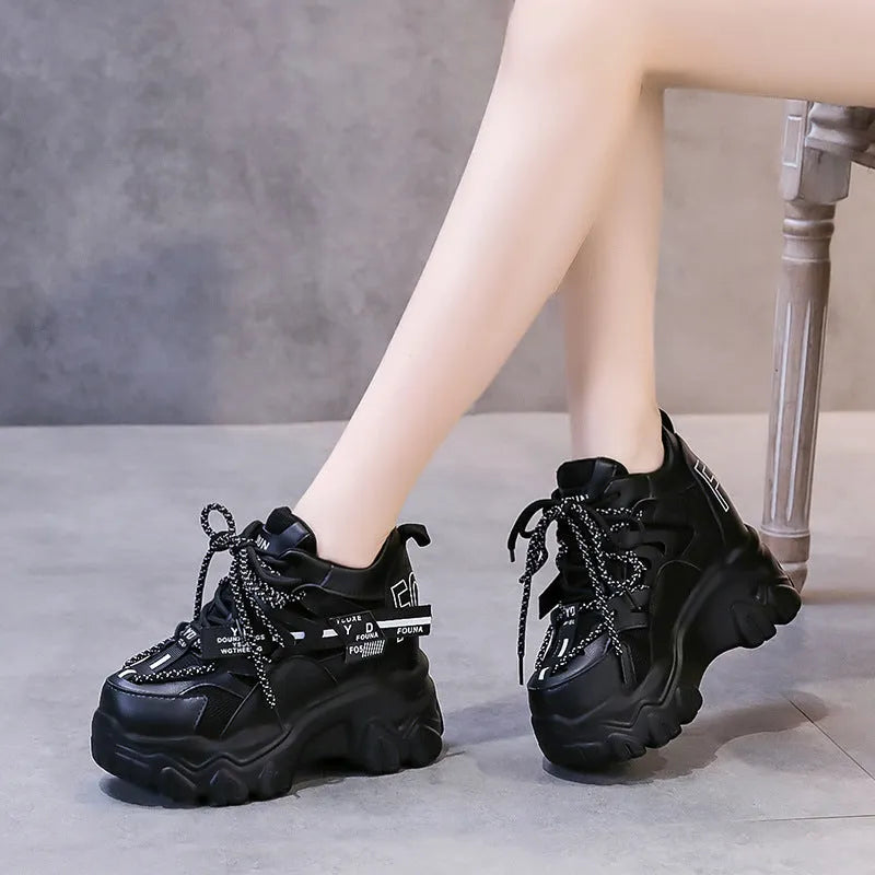 Women's white breathable mesh platform sports shoes with cross strap and rubber sole.