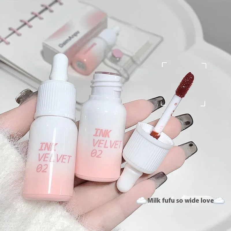 Mirror Lip Lacquer tube in one of four shades: Spring Day Wilderness, Orange Tabby Cat Diary, Low-Key Charming, or Misty Berry.