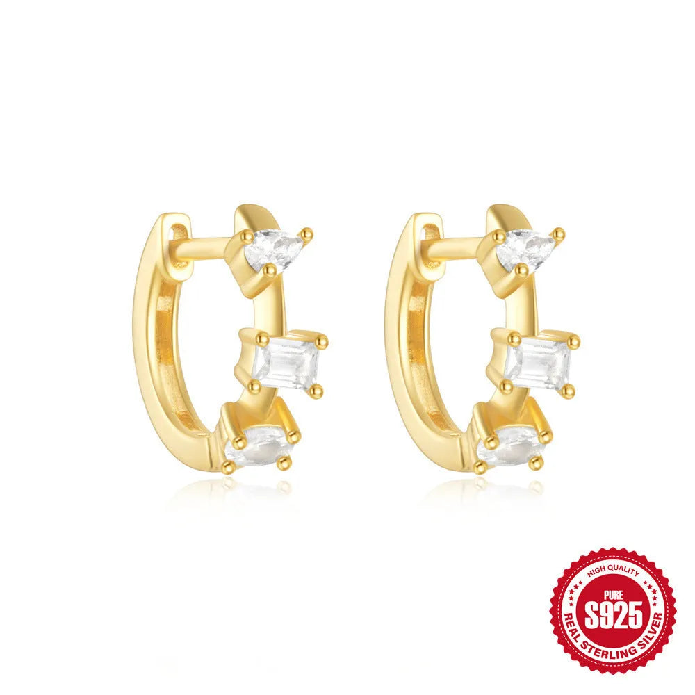 Small round geometric sterling silver stud earrings in gold and silver electroplated finishes.