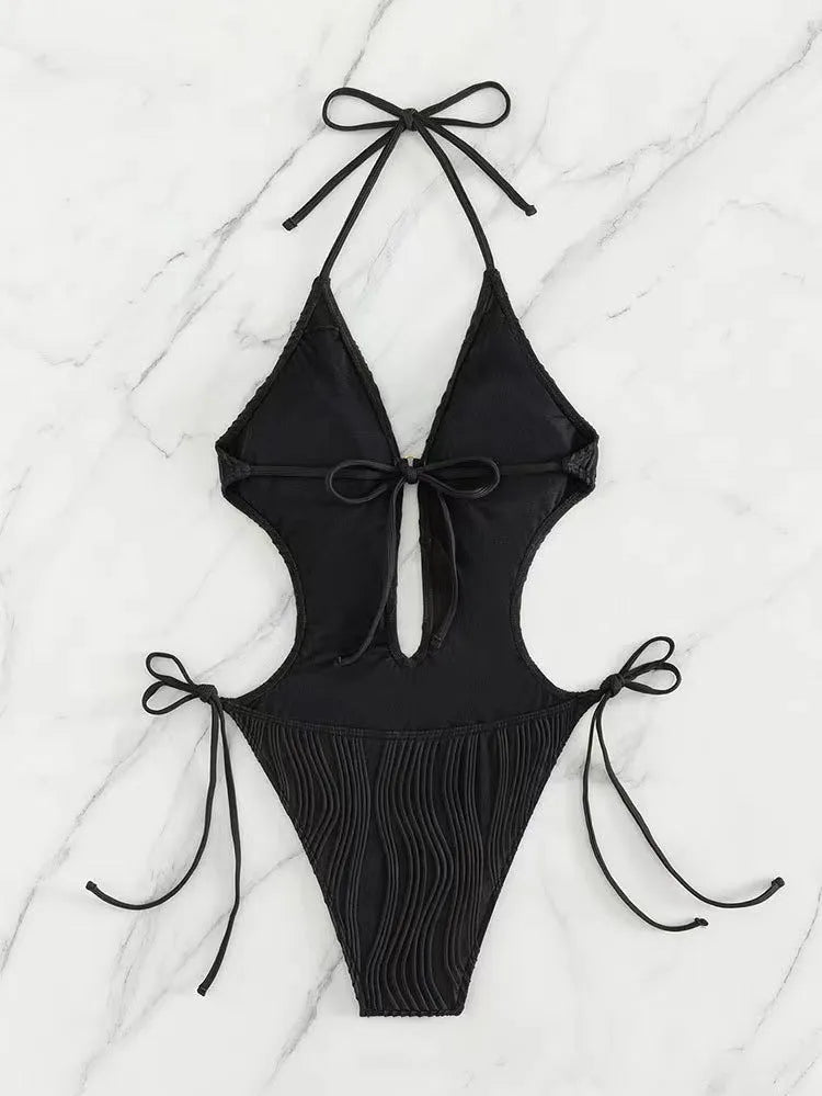 Women's black lace-up triangle bikini swimsuit with solid colour design