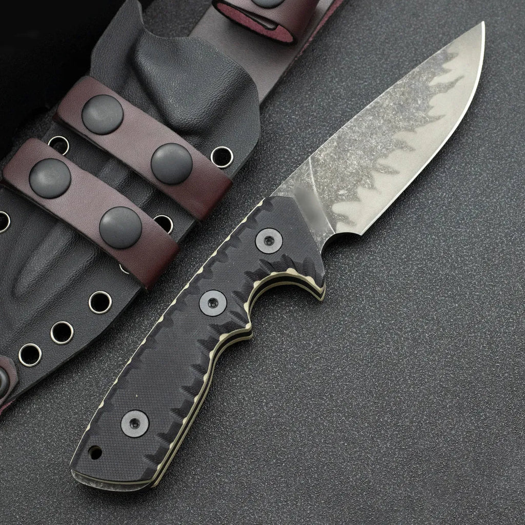 Portable camping knife with black handle and 100mm blade on plain background