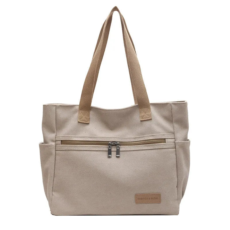 Canvas shoulder bag for women with contrast stitching and double shoulder straps, available in grey
