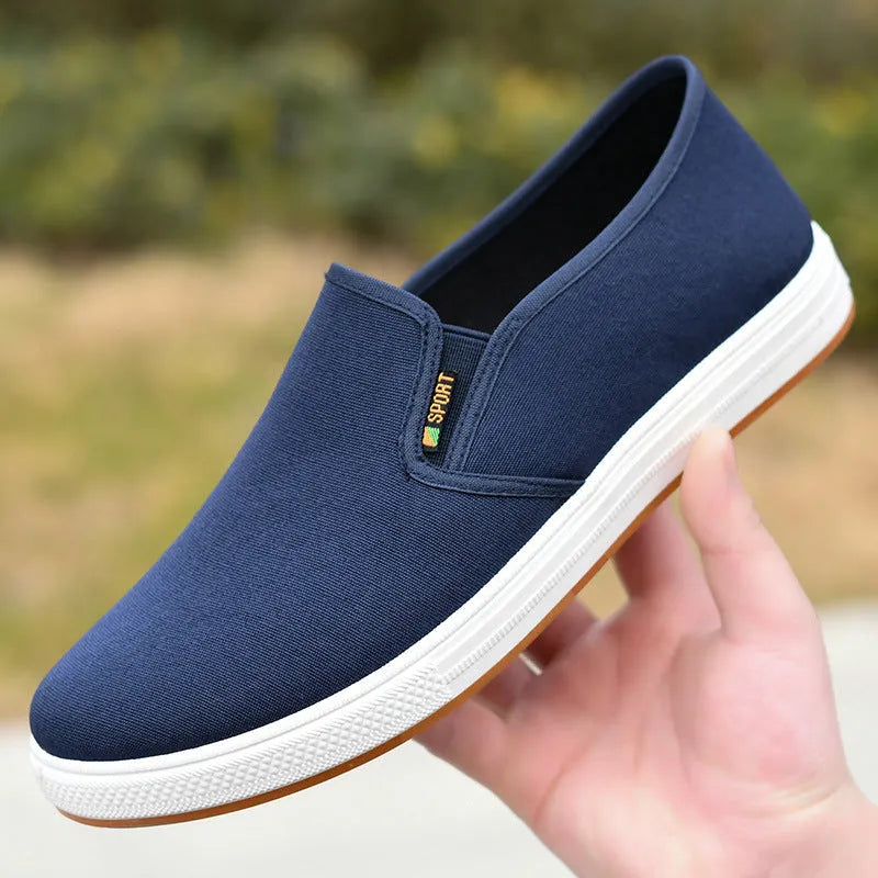Men's black and blue canvas slip-on shoes with low-top design and round toe